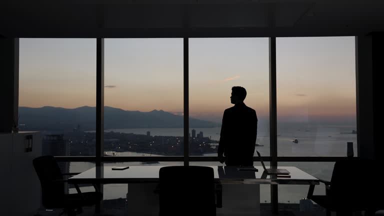Businessman looking out of the window.
